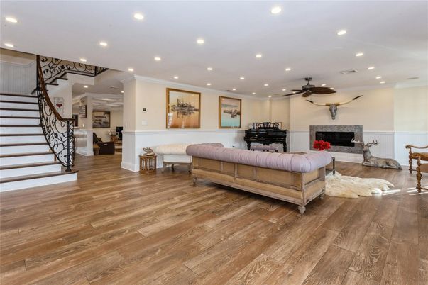 Fireplace, Interior, Living room, Piano, Recessed Lighting, Wood Texture Flooring