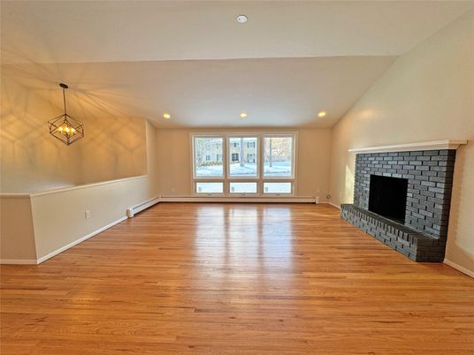 Empty room, Fireplace, Interior, Pendant Lights, Recessed Lighting, Wood Texture Flooring