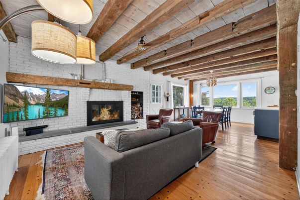 Dining room, Fireplace, Interior, Living room, Pendant Lights, Stone Walls, Wooden Beams, Wooden Ceilings, Wood Texture Flooring