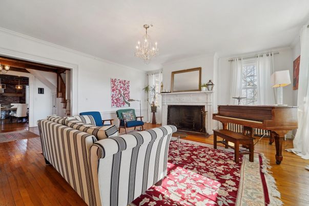 Chandelier, Dining room, Fireplace, Interior, Living room, Piano, Wood Texture Flooring