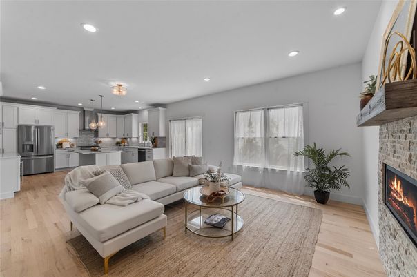 Fireplace, Interior, Kitchen, Living room, Pendant Lights, Recessed Lighting, Stainless Steel Appliances, Wood Texture Flooring
