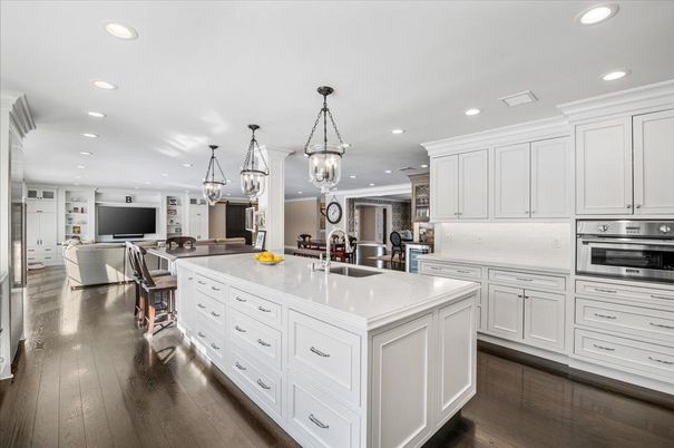 Chandelier, Interior, Kitchen, Living room, Pendant Lights, Recessed Lighting, Stainless Steel Appliances, Wood Texture Flooring