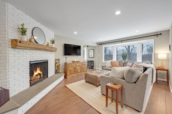 Fireplace, Interior, Living room, Recessed Lighting, Stone Walls, Wood Texture Flooring