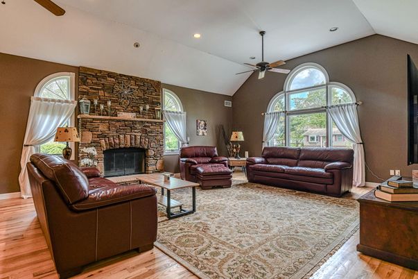 Fireplace, Interior, Living room, Recessed Lighting, Stone Walls, Wood Texture Flooring