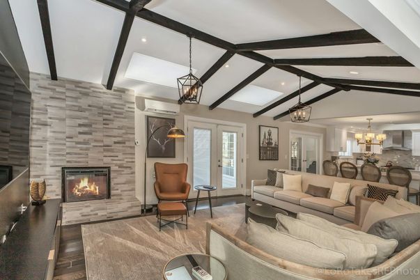 Chandelier, Dining room, Fireplace, Interior, Living room, Pendant Lights, Recessed Lighting, Stone Walls, Wooden Beams, Wood Texture Flooring
