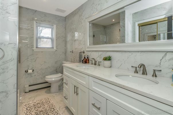 Bathroom, Dual Sink Vanities, Interior, Marble, Marble Walls, Recessed Lighting