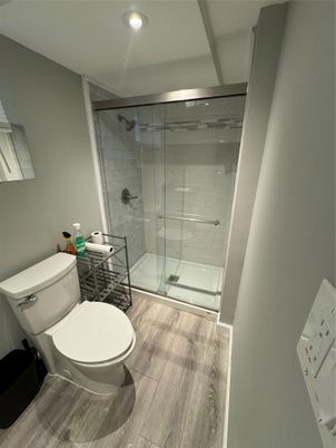 Bathroom, Glass Shower, Interior, Recessed Lighting, Wood Texture Flooring