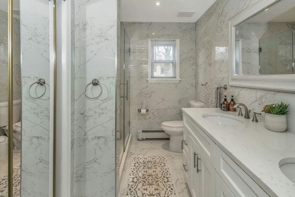 Bathroom, Dual Sink Vanities, Glass Shower, Interior, Marble, Marble Walls, Recessed Lighting