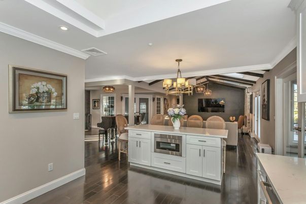 Chandelier, Dining room, Interior, Kitchen, Recessed Lighting, Stainless Steel Appliances, Wooden Beams, Wood Texture Flooring