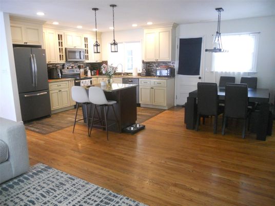 Dining room, Interior, Kitchen, Pendant Lights, Recessed Lighting, Stainless Steel Appliances, Wood Texture Flooring