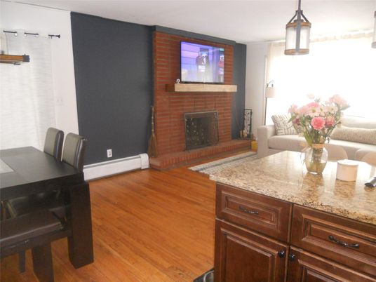 Dining room, Fireplace, Interior, Stone Walls, Wood Texture Flooring