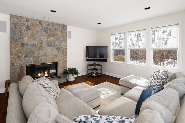 Fireplace, Interior, Living room, Recessed Lighting, Stone Walls, Wood Texture Flooring