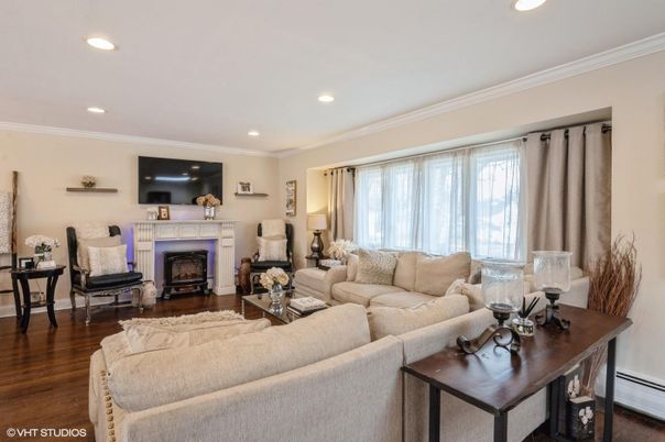 Fireplace, Interior, Living room, Piano, Recessed Lighting, Wood Texture Flooring