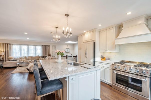 Chandelier, Dining room, Interior, Kitchen, Living room, Recessed Lighting, Stainless Steel Appliances, Wood Texture Flooring