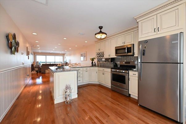 Dining room, Interior, Kitchen, Recessed Lighting, Stainless Steel Appliances, Wood Texture Flooring