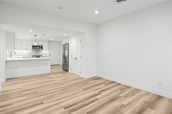 Interior, Kitchen, Pendant Lights, Recessed Lighting, Stainless Steel Appliances, Wood Texture Flooring