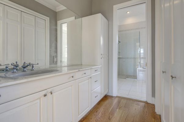 Bathroom, Dual Sink Vanities, Glass Shower, Interior, Recessed Lighting, Wood Texture Flooring