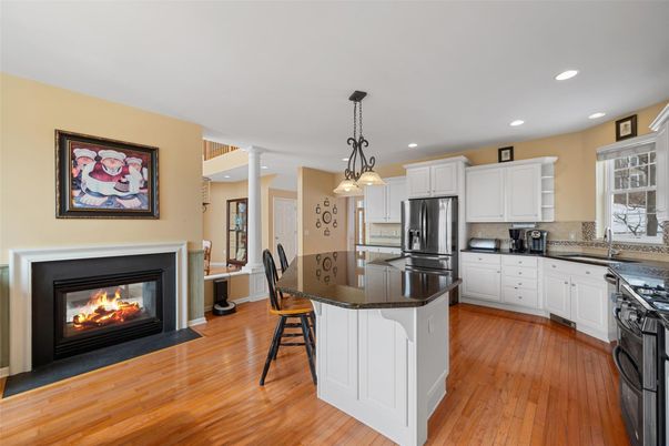 Fireplace, Interior, Kitchen, Pendant Lights, Recessed Lighting, Stainless Steel Appliances, Wood Texture Flooring