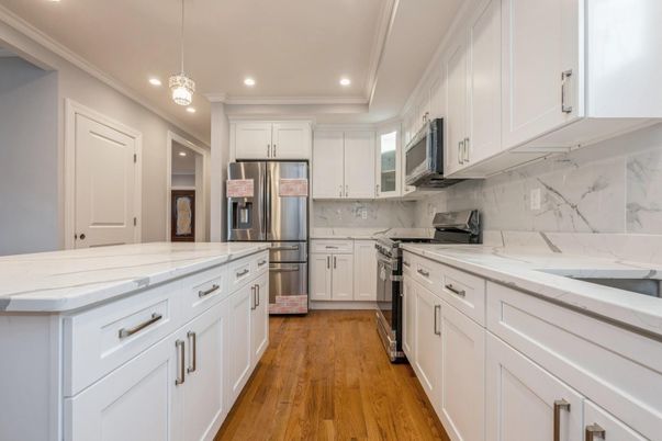 Interior, Kitchen, Marble Walls, Pendant Lights, Recessed Lighting, Stainless Steel Appliances, Wood Texture Flooring