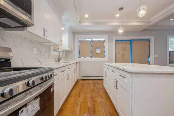 Interior, Kitchen, Marble Walls, Pendant Lights, Recessed Lighting, Stainless Steel Appliances, Wood Texture Flooring