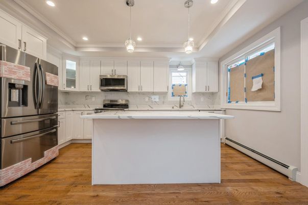 Interior, Kitchen, Marble Walls, Pendant Lights, Recessed Lighting, Stainless Steel Appliances, Wood Texture Flooring