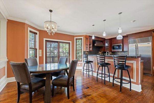 Chandelier, Dining room, Interior, Kitchen, Pendant Lights, Stainless Steel Appliances, Wood Texture Flooring