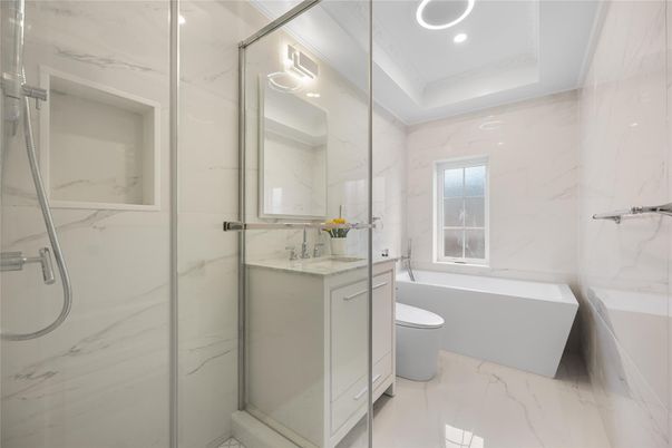 Bathroom, Dual Sink Vanities, Free Standing Baths, Glass Shower, Interior, Marble, Marble Walls, Recessed Lighting