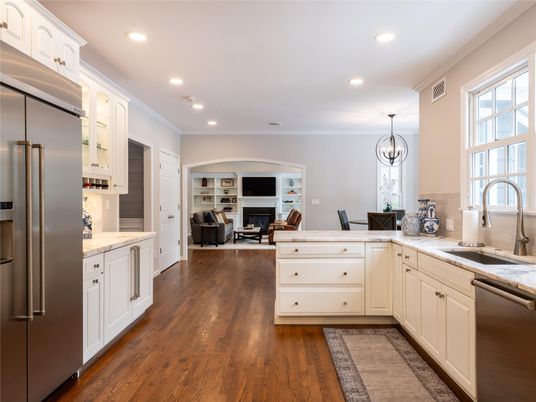 Chandelier, Dining room, Fireplace, Interior, Kitchen, Living room, Pendant Lights, Recessed Lighting, Stainless Steel Appliances, Wood Texture Flooring