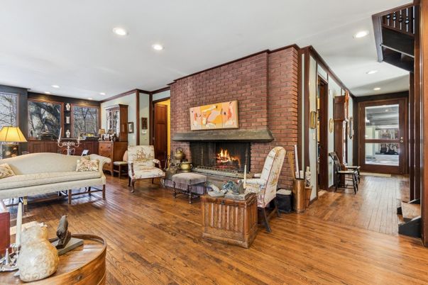 Fireplace, Interior, Living room, Recessed Lighting, Stone Walls, Wood Texture Flooring