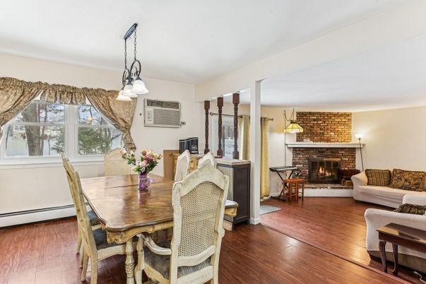 Dining room, Fireplace, Interior, Living room, Pendant Lights, Stone Walls, Wood Texture Flooring