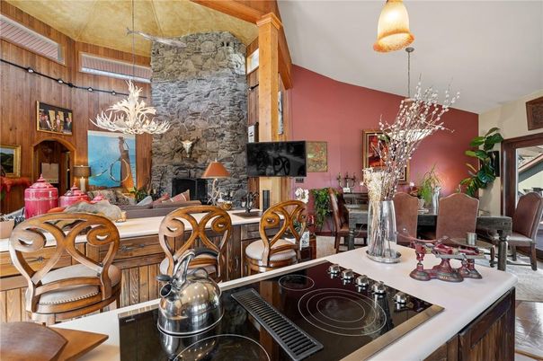 Chandelier, Dining room, Fireplace, Interior, Kitchen, Living room, Pendant Lights, Stone Walls