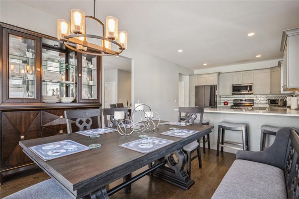 Chandelier, Dining room, Interior, Kitchen, Recessed Lighting, Stainless Steel Appliances, Wood Texture Flooring