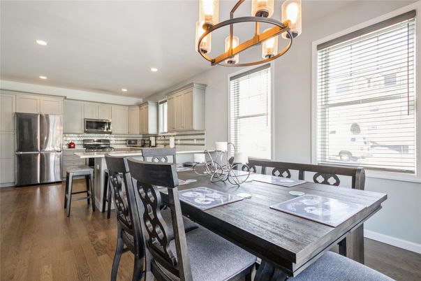 Dining room, Interior, Kitchen, Pendant Lights, Recessed Lighting, Stainless Steel Appliances, Wood Texture Flooring