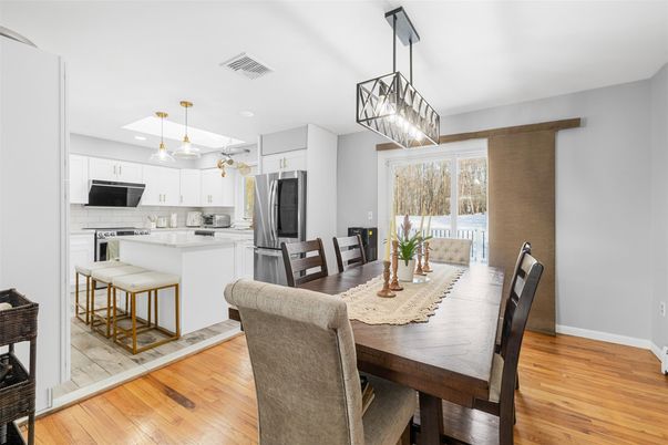 Dining room, Interior, Kitchen, Pendant Lights, Recessed Lighting, Stainless Steel Appliances, Wood Texture Flooring