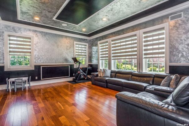 Fireplace, Fitness Equipment, Interior, Living room, Recessed Lighting, Wood Texture Flooring