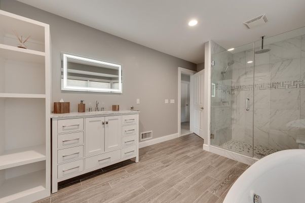 Bathroom, Dual Sink Vanities, Glass Shower, Interior, Marble Walls, Recessed Lighting, Wood Texture Flooring