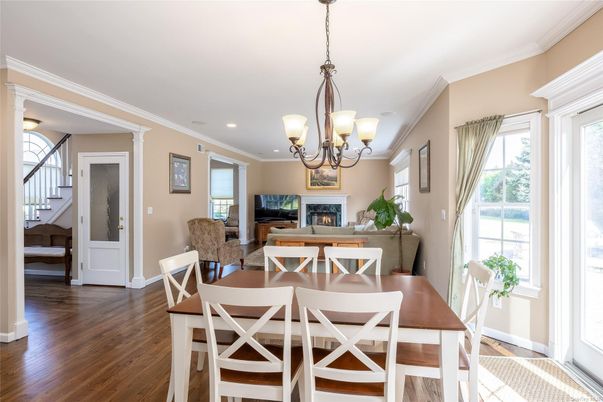 Chandelier, Dining room, Fireplace, Interior, Living room, Recessed Lighting, Wood Texture Flooring