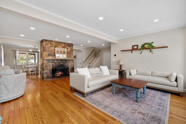 Dining room, Fireplace, Interior, Living room, Recessed Lighting, Stone Walls, Wood Texture Flooring