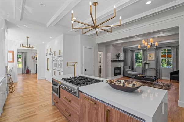 Chandelier, Fireplace, Interior, Kitchen, Living room, Pendant Lights, Recessed Lighting, Wood Texture Flooring