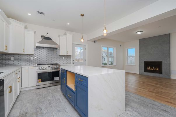 Fireplace, Interior, Kitchen, Pendant Lights, Recessed Lighting, Stainless Steel Appliances, Wood Texture Flooring