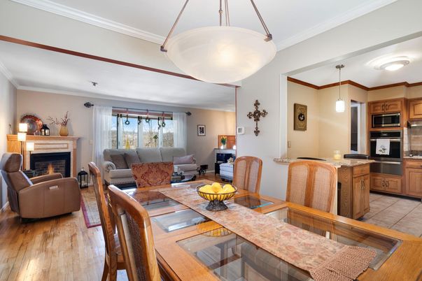 Dining room, Fireplace, Interior, Kitchen, Living room, Pendant Lights, Stainless Steel Appliances, Wood Texture Flooring
