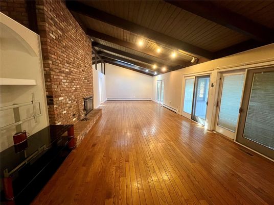Empty room, Fireplace, Interior, Stone Walls, Wooden Beams, Wood Texture Flooring