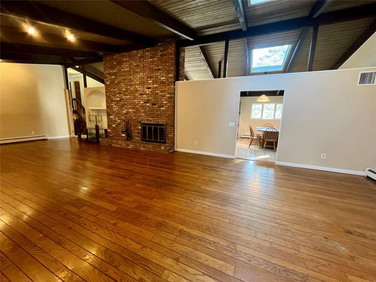 Empty room, Fireplace, Interior, Stone Walls, Wooden Beams, Wood Texture Flooring