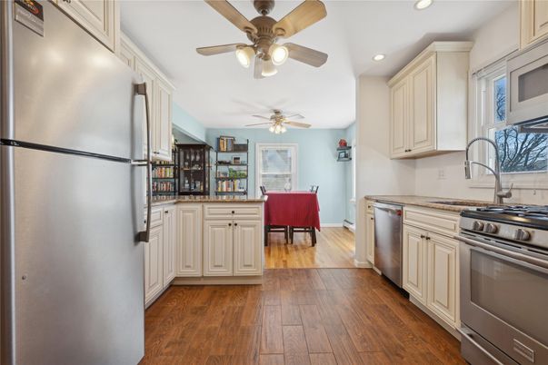 Dining room, Interior, Kitchen, Recessed Lighting, Stainless Steel Appliances, Wood Texture Flooring