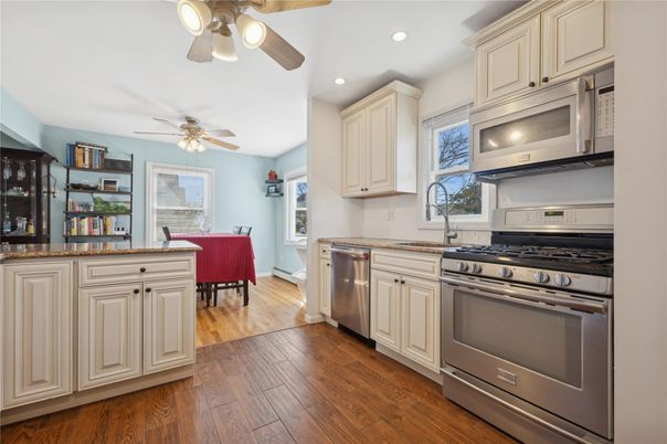 Dining room, Interior, Kitchen, Recessed Lighting, Stainless Steel Appliances, Wood Texture Flooring