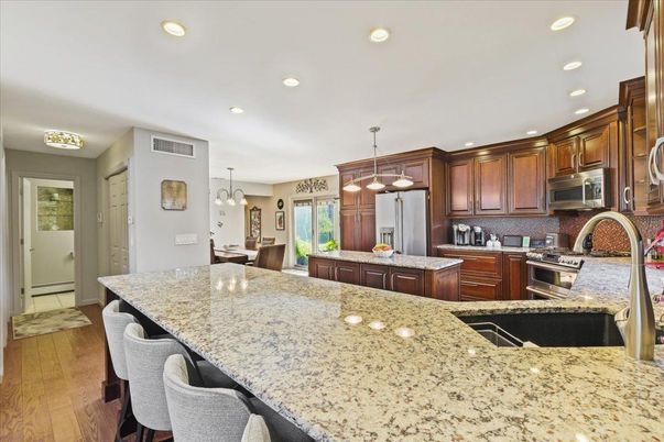 Dining room, Interior, Kitchen, Pendant Lights, Recessed Lighting, Stainless Steel Appliances, Wood Texture Flooring