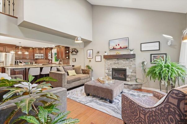 Fireplace, Interior, Kitchen, Living room, Pendant Lights, Recessed Lighting, Stainless Steel Appliances, Wood Texture Flooring