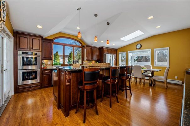 Dining room, Interior, Kitchen, Pendant Lights, Recessed Lighting, Stainless Steel Appliances, Wood Texture Flooring