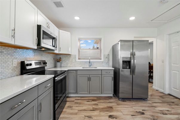 Interior, Kitchen, Recessed Lighting, Stainless Steel Appliances, Wood Texture Flooring
