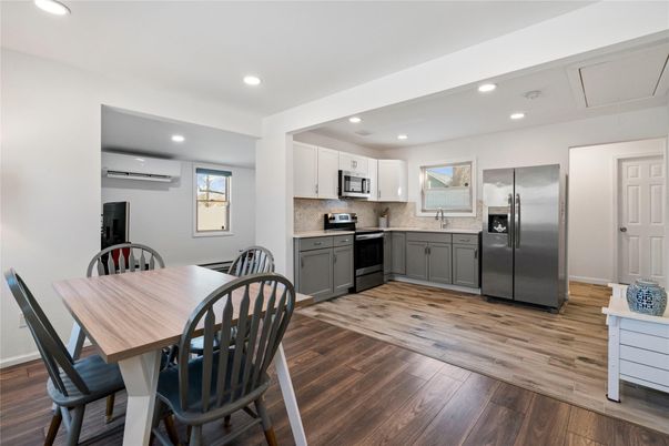 Dining room, Interior, Kitchen, Recessed Lighting, Stainless Steel Appliances, Wood Texture Flooring
